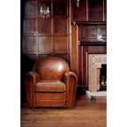 Poltrona Club in vera pelle marrone con borchie e struttura in legno